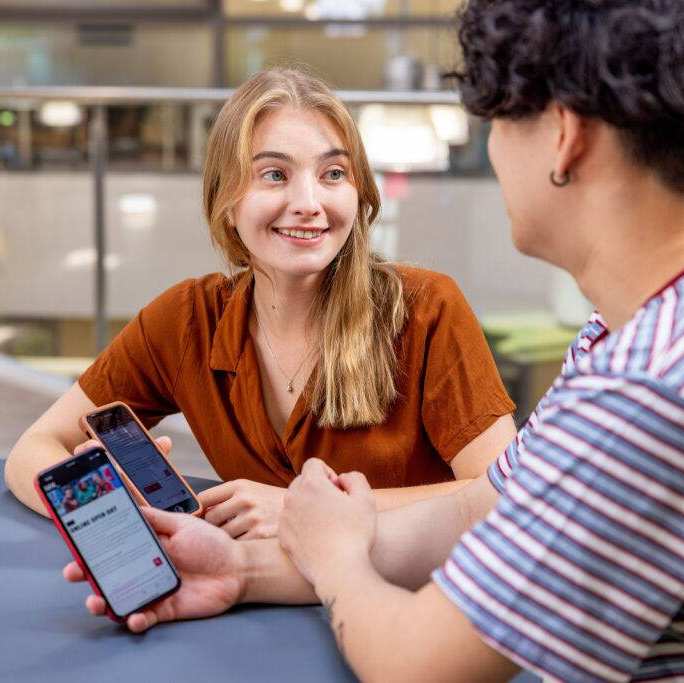 International students signing up for the Online Open Day on their phones. 