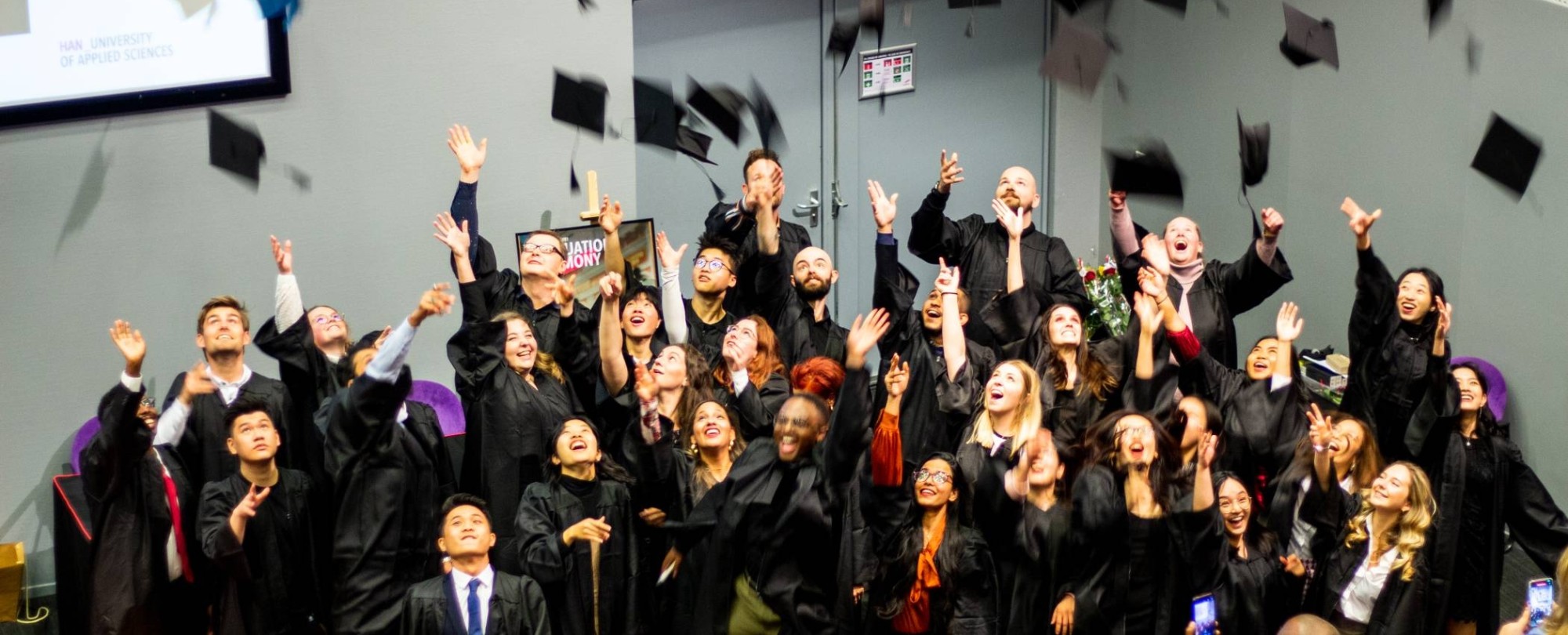 The picture shows the throwing of the hat by ISB graduates.