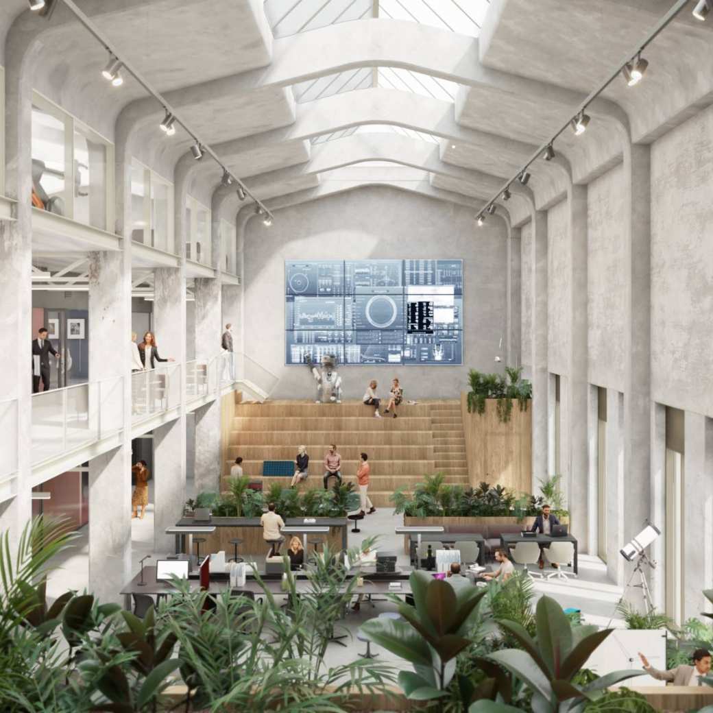 industrieel pand aan de binnenkant met hoge plafonds en veel lichtinval en veel beton.